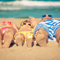 Happy,Family,Having,Fun,On,The,Beach.,Summer,Vacation,And